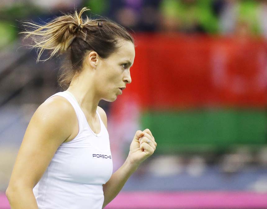 Tatjana Maria of Germany celebrates winning a point against Aryna Sabalenka of Belarus during the Fed Cup World Group first round match between Belarus and Germany in Minsk, Belarus on Saturday.