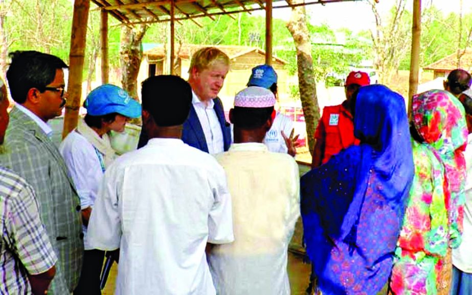 British Foreign Secretary Boris Johnson talking to Rohingayas at Kutupalong camp in Cox;s Bazar while visiting there on Saturday.