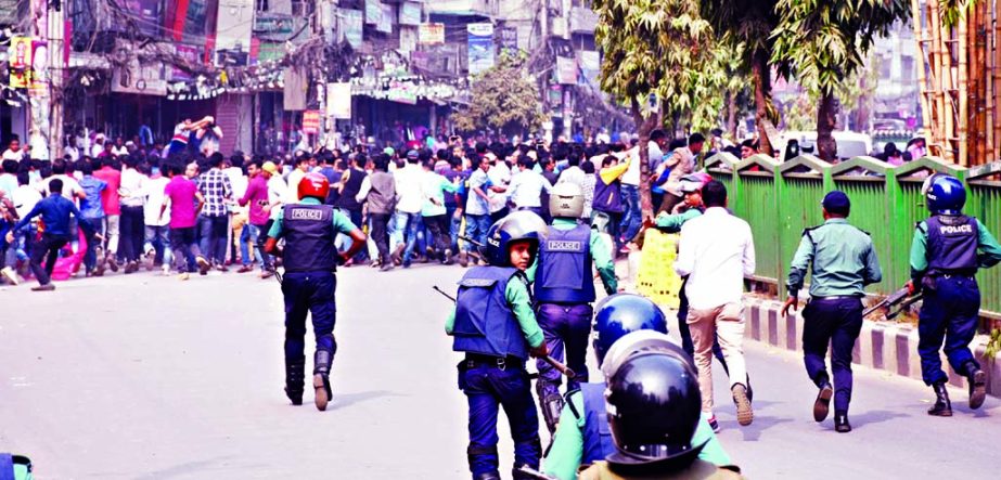 Law enforcers chasing the BNP supporters when they staged demonstration on the second day of the programs demanding Khaleda Zia's immediate release. This photo was taken from Fakirapool area on Saturday.