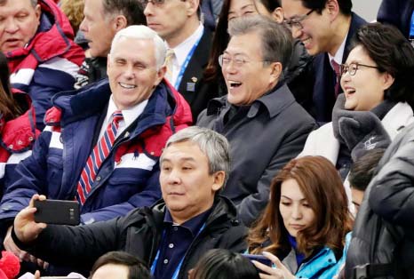 United States' Vice President Mike Pence and South Korean President Moon Jae-in laugh during the ladies' 500 meters short-track speedskating in the Gangneung Ice Arena at the 2018 Winter Olympics in Gangneung, South Korea on Saturday