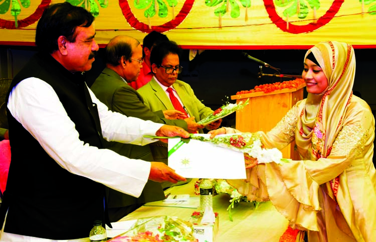 Shipping Minister Shajahan Khan distributing stipend among the meritorious wards of officials and employees of Bangladesh Inland Water Transport Corporation at its office in the city on Sunday.