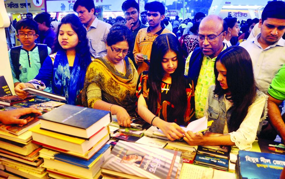 Amar Ekushey Boi Mela being gradually overcrowded specially women book lovers engaged in to have their choice on Monday.