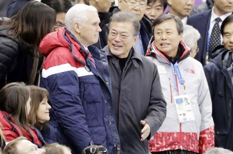 Vice President Mike Pence, center left and South Korean President Moon Jae-in attend the ladies' 500 meters short-track speedskating in the Gangneung Ice Arena at the 2018 Winter Olympics in Gangneung, South Korea.