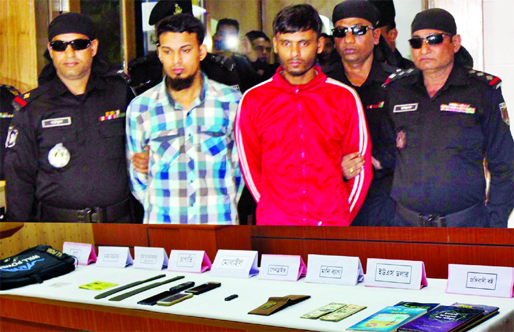 Two JMB activists were arrested from city's Tejgaon area with some locally made weapons and Jihadi books by RAB-2. This picture was taken from RAB Media Centre on Tuesday.