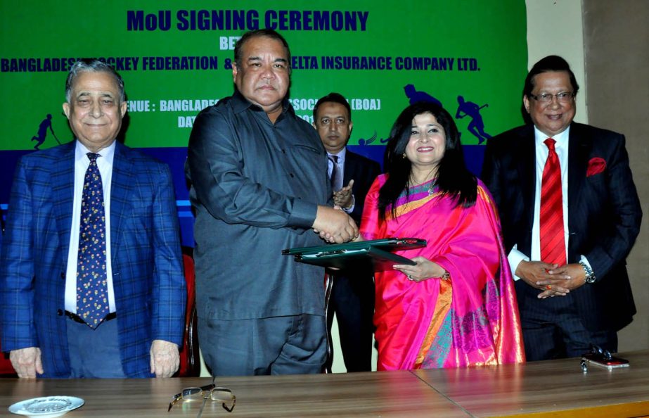 President of Bangladesh Hockey Federation (BHF) and Chief of Air Staff Air Marshal Abu Esrar shaking hands with Farzana Chowdhury, CEO of Green Delta Insurance Company Limited after the signing ceremony between BHF and Green Delta Insurance Company Limite