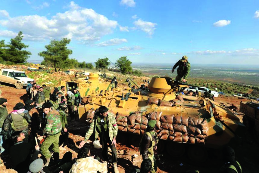 Turkish troops and pro-Turkey Syrian fighters trying to take control of Bursayah hill, which separates the Kurdish-held enclave of Afrin from the Turkey-controlled town of Azaz, Syria. AP file photo