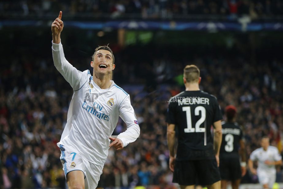 Real Madrid's Cristiano Ronaldo celebrates his side's 2nd goal during the Champions League soccer match, round of 16, 1st leg between Real Madrid and Paris Saint Germain at the Santiago Bernabeu stadium in Madrid, Spain on Wednesday.