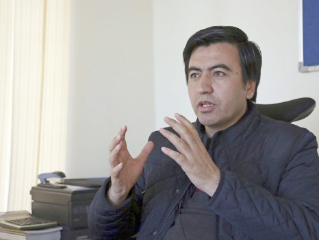 Abdul Wadood Pedram, of the Kabul-based Human Rights and Eradication of Violence Organization, gives an interview to The Associated Press in Kabul, Afghnistan. Since the International Criminal Court began collecting material three months ago for a possibl