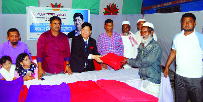 SYLHET: Former ambassador and permanent representative to the UN Dr A K Abdul Momen distributing winter clothes among the distressed people at Akhalia Niaripara area in Sylhet city recently.