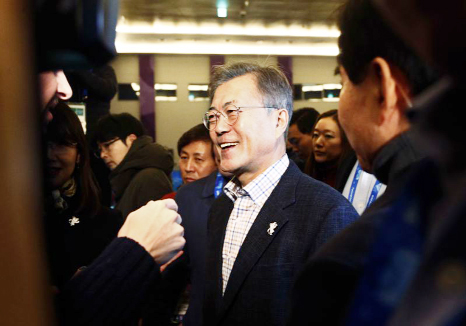 South Korean President Moon Jae-in passes journalists during a visit to the Main Press Center at the 2018 Winter Olympics in Pyeongchang, South Korea on Saturday.