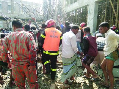 GAFARGAON (Mymensingh): Fire Service men and locals rescuing injured people under the roof of an auditorium collapsed at Gafargaon on Friday.