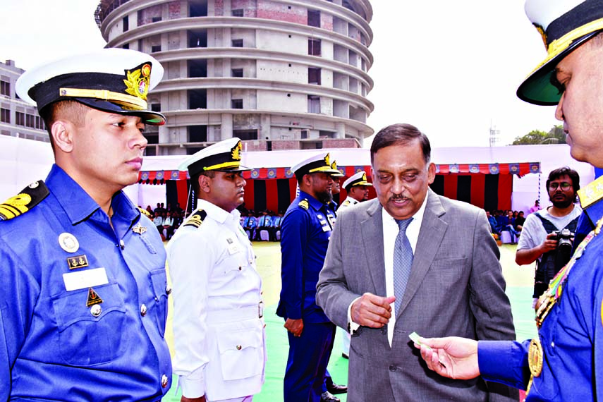 Home Minister Asaduzzaman Khan distributing Bangladesh Coastguard Medals among the officials and employees of Bangladesh Coastguard at a ceremony organised recently at its Headquarters in the city 's Agargaon.