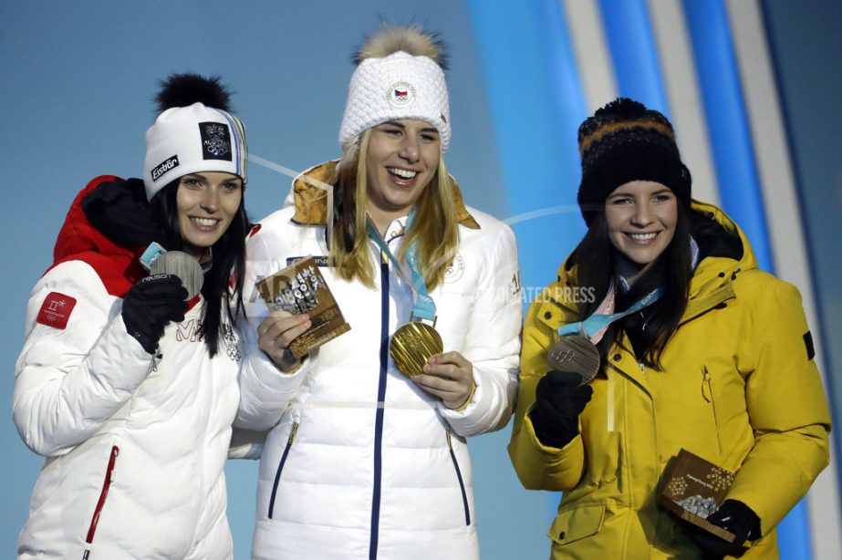 Medalists in the women's super-G from (left) Austria's Anna Veith (silver) Czech Republic's Ester Ledecka (gold) and Liechtenstein's Tina Weirather (bronze) pose during their medals ceremony at the 2018 Winter Olympics in Pyeongchang, South Korea on S