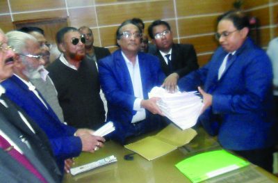 RAJBARI: Ali Nawaj Mahmud Khaiyam, President, Rajbari BNP with other leaders giving a copy of memorandum and mass signatures to Md Shawkat Ali, DC, Rajbari demanding withdrawal of case against all BNP leaders and release of BNP Chairperson Begum Kha