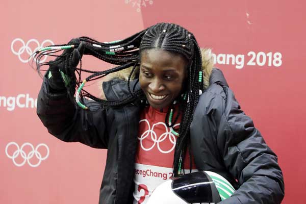 Simidele Adeagbo of Nigeria reacts in the finish area after the final run of the women's skeleton competition at the 2018 Winter Olympics in Pyeongchang, South Korea on Saturday.