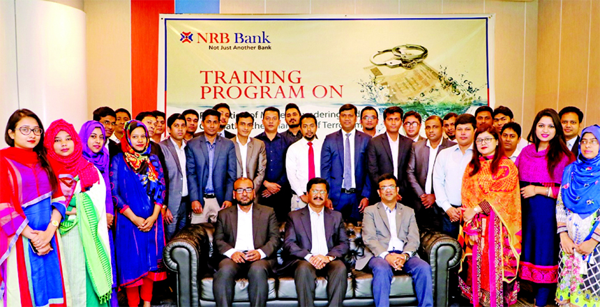 Md. Mehmood Husain, Managing Director of NRB Bank Limited, poses with the participants of a day-long training program on "Prevention of Money Laundering and Terrorist Financing" at its head office in the city on Saturday. High officials of the bank were