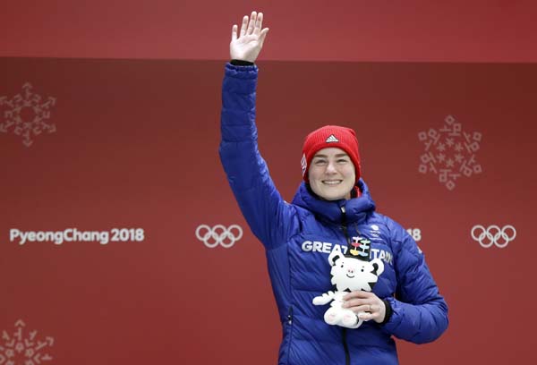 Laura Deas of Britain celebrates winning the bronze medal in the finish area after the final run of the women's skeleton competition at the 2018 Winter Olympics in Pyeongchang, South Korea on Saturday.