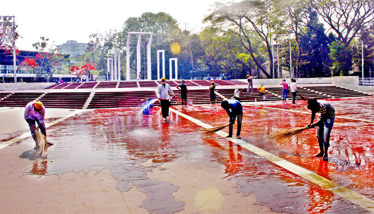 Premises of Central Shaheed Minar being washed just ahead of Amar Ekushey February. This photo was taken on Sunday.