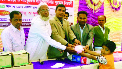 DUPCHANCHIA (Bogra): Mosiul Islam, Assistant Upazla Education Officer distributing prizes among the winners of annual sports and cultural function of Dupchanchia Pre-cadet School on Sunday.