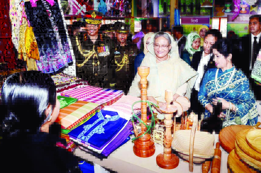 Prime Minister Sheikh Hasina visited different stalls installed on the occasion of 38th national congregation of Bangladesh Ansar and Village Defence Force at Safipur on Monday. PID photo
