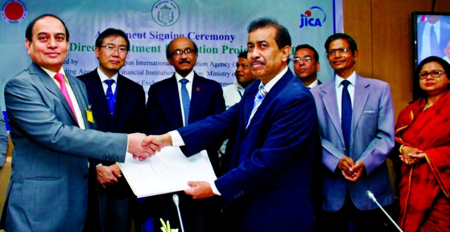 M Fakhrul Alam, Managing Director of ONE Bank Limited and Rezaul Islam, General Manager of Bangladesh Bank sign a participatory agreement regarding use of JICA assisted Foreign Direct Investment Promotion Project fund recently. Governor Fazle Kabir, Deput