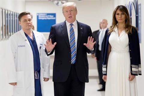 US President Donald Trump and First Lady Melania Trump visit a Florida hospital on Monday after a school shooting that left 17 dead.