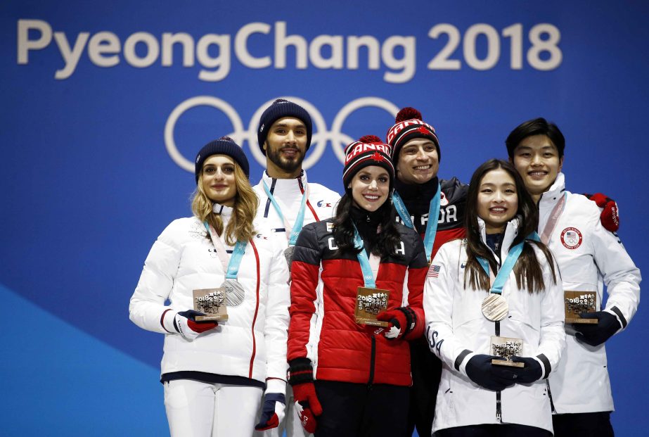 Medalists in the ice dance, free dance figure skating (from left) : Gabriella Papadakis and Guillaume Cizeron, of France (silver), Tessa Virtue and Scott Moir of Canada (gold) and Maia Shibutani and Alex Shibutani of the United States (bronze) pose during