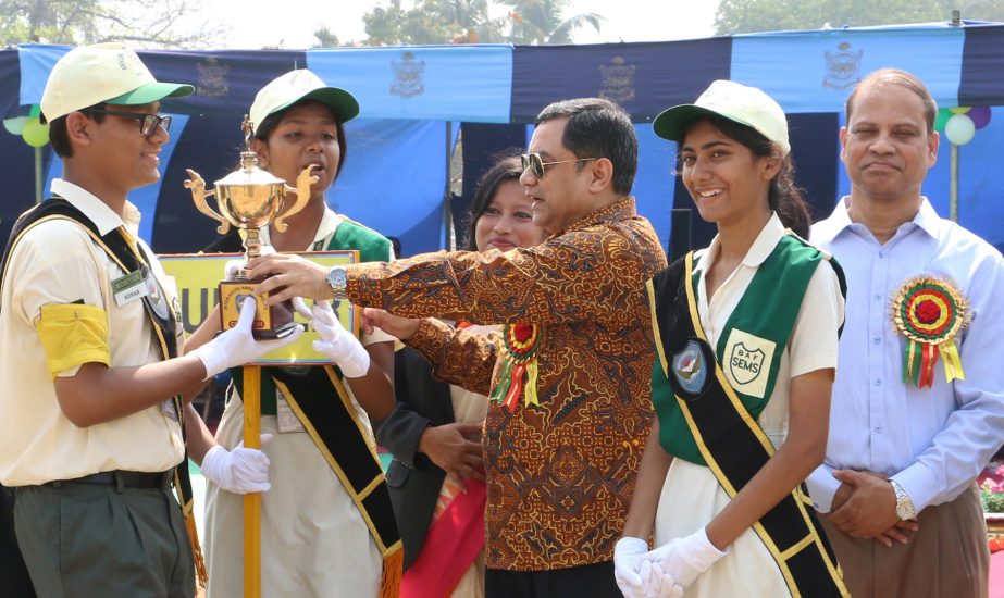 Air Officer Commanding of BAF Base Bashar Air Vice Marshal Ehsanul Gani Choudhury handing over the trophy to the winners of the Annual Sports Competition of the BAF Shaheen English Medium School (SEMS) at the School premises in the city on Saturday.