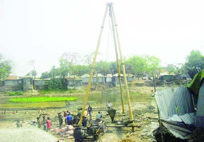 SUNDARGANJ(Gaibandha ): Piling of Girder Bridge construction is going on at Sundarganj Upazila . This snap was taken yesterday.