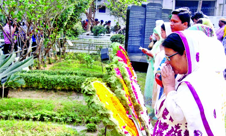 Relatives of killed army officials in Pilkhana BDR carnage placing floral wreaths at their graves in Banani Army Graveyard in the city on Sunday marking ninth anniversary of BDR carnage.