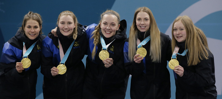 Anna Hasselborg of Sweden, Sara Mcmanus, Agnes Knochenhauer, Sofia Mabergs and Jennie Waahlin pose with their gold medals after their women's curling final in the Gangneung Curling Centre at the 2018 Winter Olympics in Gangneung, South Korea, Sunday.