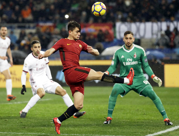 Roma's Cengiz Under goes for the ball during a Serie A soccer match between Roma and AC Milan at the Rome Olympic stadium on Sunday.