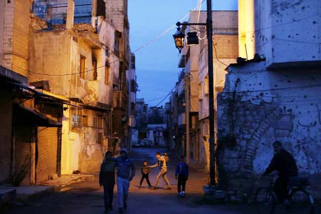 Children play in the war-damaged Bab Dreib neighborhood of the old city of Homs, Syria.