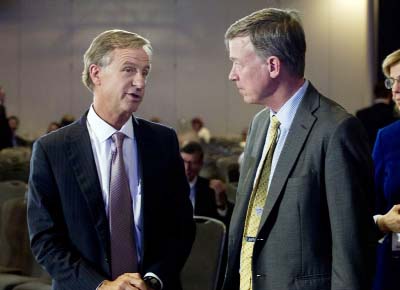 Tennessee Gov. Bill Haslam, left, speaks with Colorado Gov. John Hickenlooper at the National Governor Association winter meeting on Sunday in Washington.