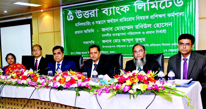 Mohammed Rabiul Hossain, Managing Director of Uttara Bank Limited, presiding over its daylong workshop on 'Prevention of Money Laundering & Terrorist Financing' at its auditorium in the city recently. Mohammed Mosharaf Hossain, AMD, Md. Abdul Quddus, Ma