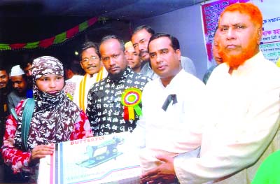 COMILLA: Shah Jalal Mojumder, Chairman, Sreepur Union Parishad distributing sewing machines among the poor women at Lotifunnesa High School premises organised by Maitree, a welfare organisation on Saturday.