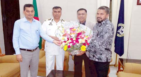 Chittagong Port Authority Commodore Zulfikar Aziz receiving bouquet from the leaders of the BGMEA at Bandar Bhaban yesterday.
