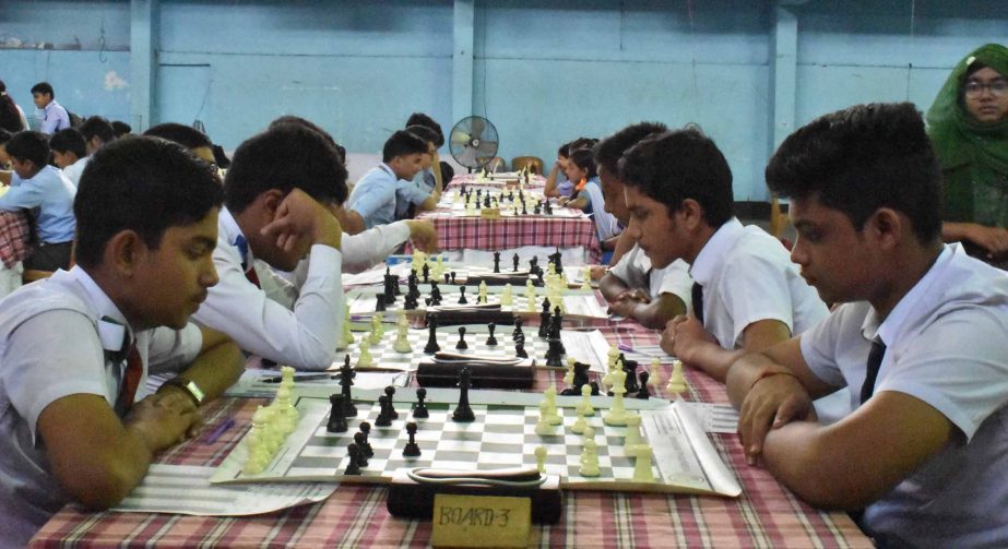 A scene from the third round matches of the CJKS-Kwality Ice Cream Inter-School Chess Tournament at the Gymnasium in the MA Aziz Stadium, Chittagong on Tuesday.