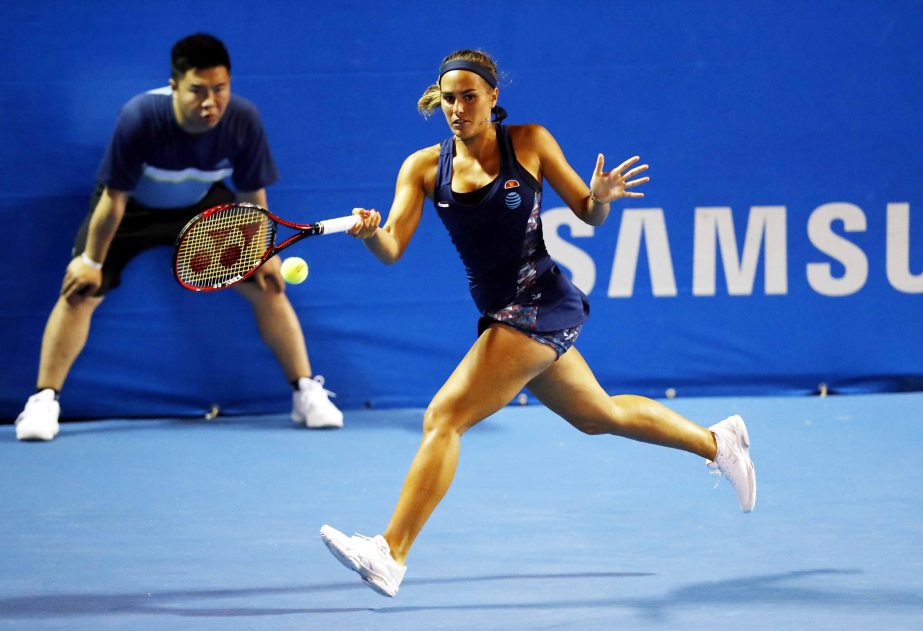 Puerto Rico's Monica Puig returns a ball as she battles with Ukraine's Dayana Yastremska during a match at the Mexican Tennis Open in Acapulco, Mexico on Monday.