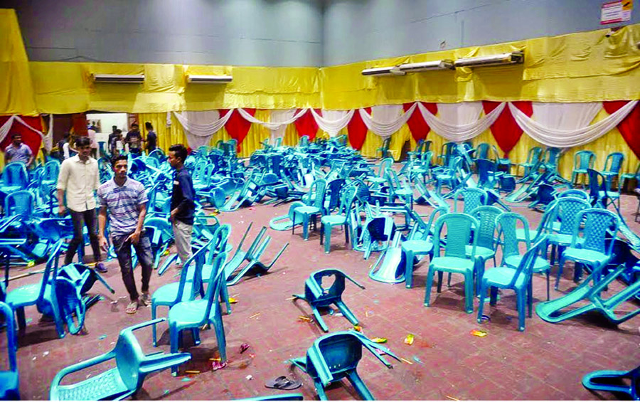 The two rival groups of Bangladesh Chhatra League in Port City threw chairs and bomb blasts, chanted slogans against each other during the infighting injuring 13 activists of both the groups on Tuesday in presence of AL Presidium Member Engineer Mosharraf