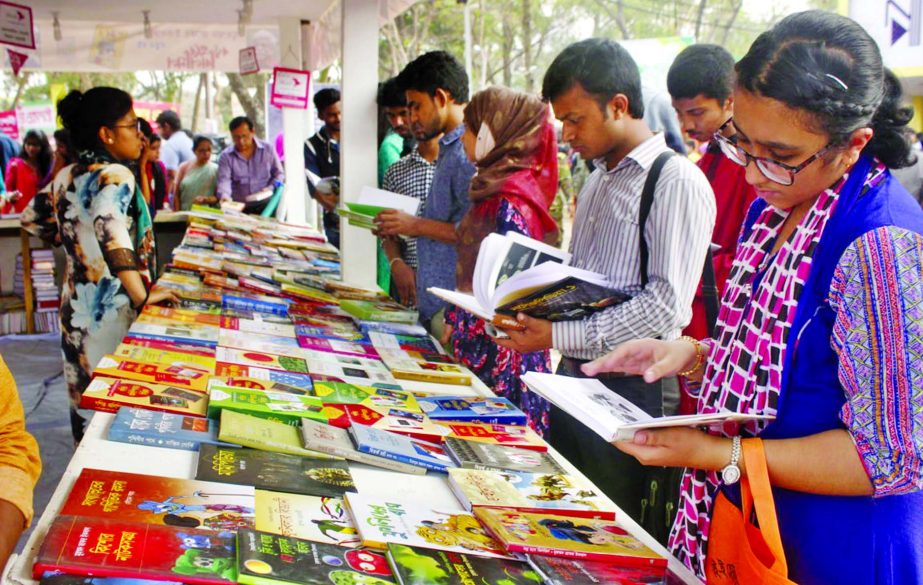 Book-lovers rush at the final stage of Amar Ekushey Boi Mela and making their choice on Tuesday.