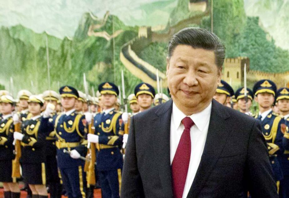 Chinese President Xi Jinping reviews a Chinese honour guard during a welcome ceremony for a visiting dignitary at the Great Hall of the People in Beijing.