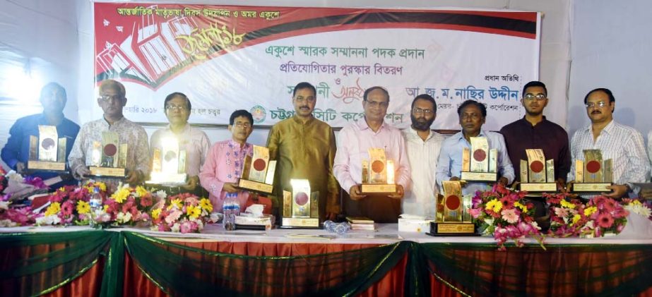 CCC Mayor A J M Nasir Uddin posed for a photo session with the recipients of Ekushey Sarak Sanmanona Padak at the Port City on Monday.