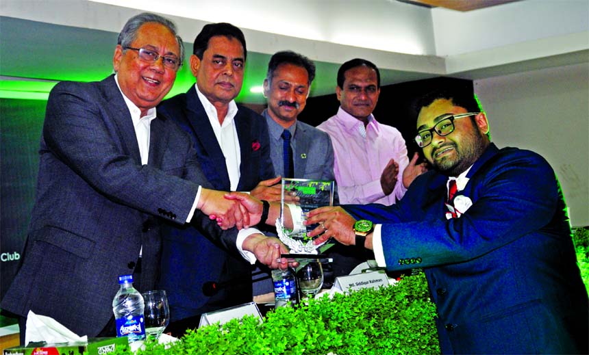 Tanvir Ahmed, Director of Envoy and Sheltech Group, receiving the 'Leed Green Factory Award' from Minister for Forest and Environment Barrister Anisul Islam Mahmud, at BGMEA auditorium in the city on Thursday. Md. Siddiqur Rahman, President of BGMEA amo
