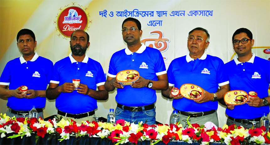 GM Kamrul Hassan, CEO of IGLOO Ice Cream and Milk Unit (a concern of Abdul Monem Limited), unveiling its new products "IGLOO Doi Ice Cream" at a hotel in the city on Thursday. Major (rtd.) Khairul Basher, GM (Admin), Abdul Monem Limited, Mazidul Haq, Mo