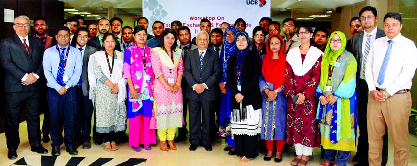 Arif Quadri, Head of Human Resources Division of United Commercial Bank, poses with the participants of the closing ceremony of a five day long 'Advance Level Workshop on Foreign Trade and Foreign Exchange' for its officials at its training centre in th