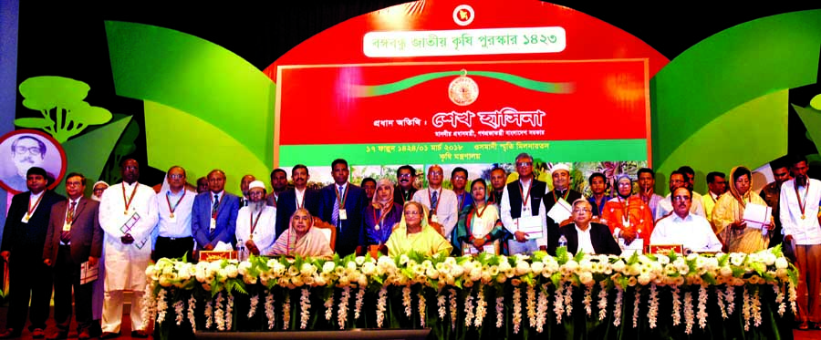 Prime Minister Sheikh Hasina at a photo session with the recipients of Bangabandhu National Agriculture Awards at the awards distribution ceremony in Osmani Memorial Auditorium in the city on Thursday. BSS photo