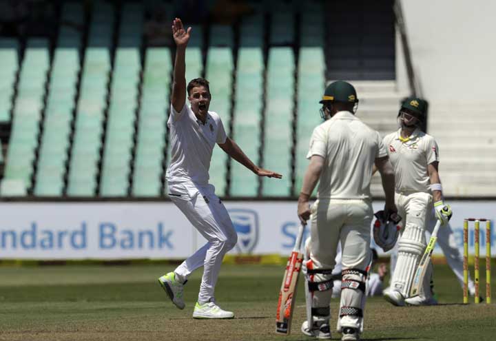 South Africa's bowler Morne Morkel (left) unsuccessfully appeals for LBW against Australia's batsman David Warner (right) on day one of the first cricket Test match between South Africa and Australia at Kingsmead stadium in Durban, South Africa on Thurs