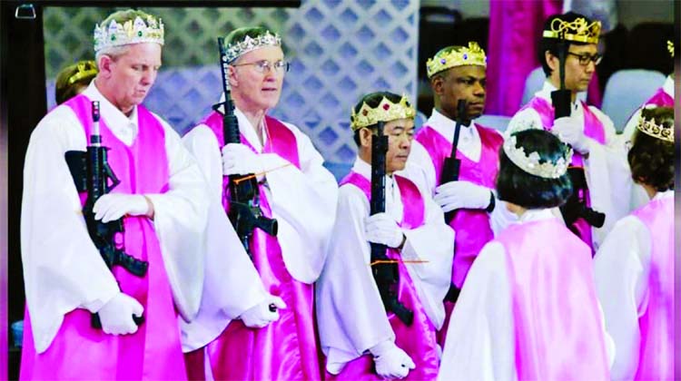 Church officials hold their AR-15-style rifles while people attend a blessing ceremony with their AR-15-style rifles at the Sanctuary Church in Newfoundland, Pennsylvania.