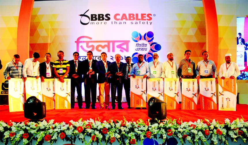 Engr. Md. Badrul Hassan, Chairman of BBS Cables Limited, poses with the participants of its '6th Dealers Conference-2018' at a convention centre in the city on Thursday. Engr. Abu Noman Howlader, Managing Director, Engr. Md. Hasan Morshed Chowdhury, Eng